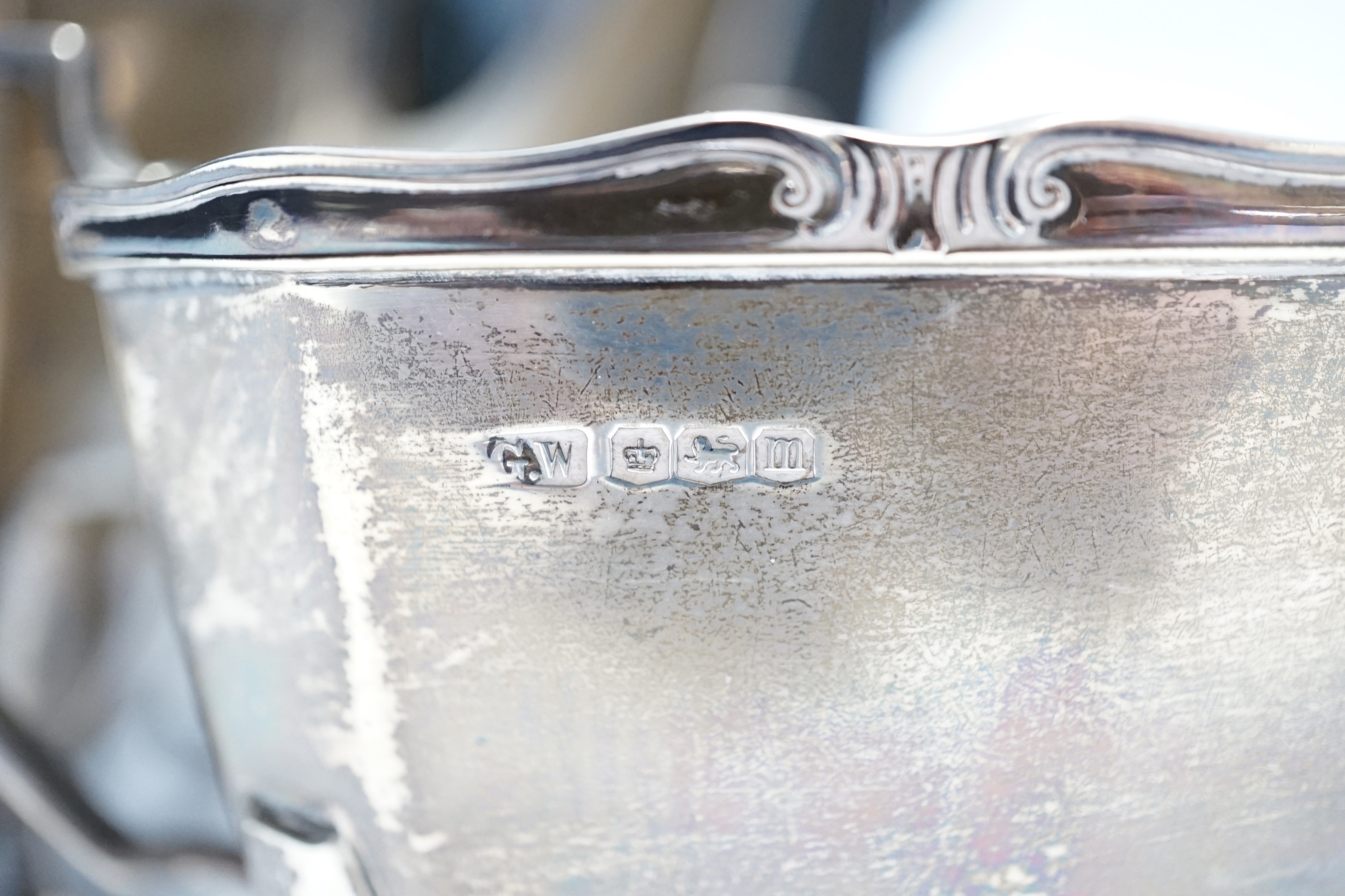 A George V silver three piece silver tea set, George Wish, Sheffield, 1929, 37.6oz, together with a silver plated hot water pot.